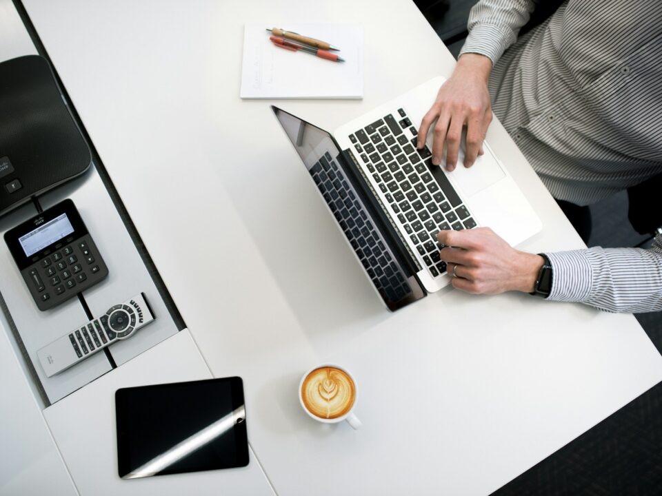 A Person Using A Laptop